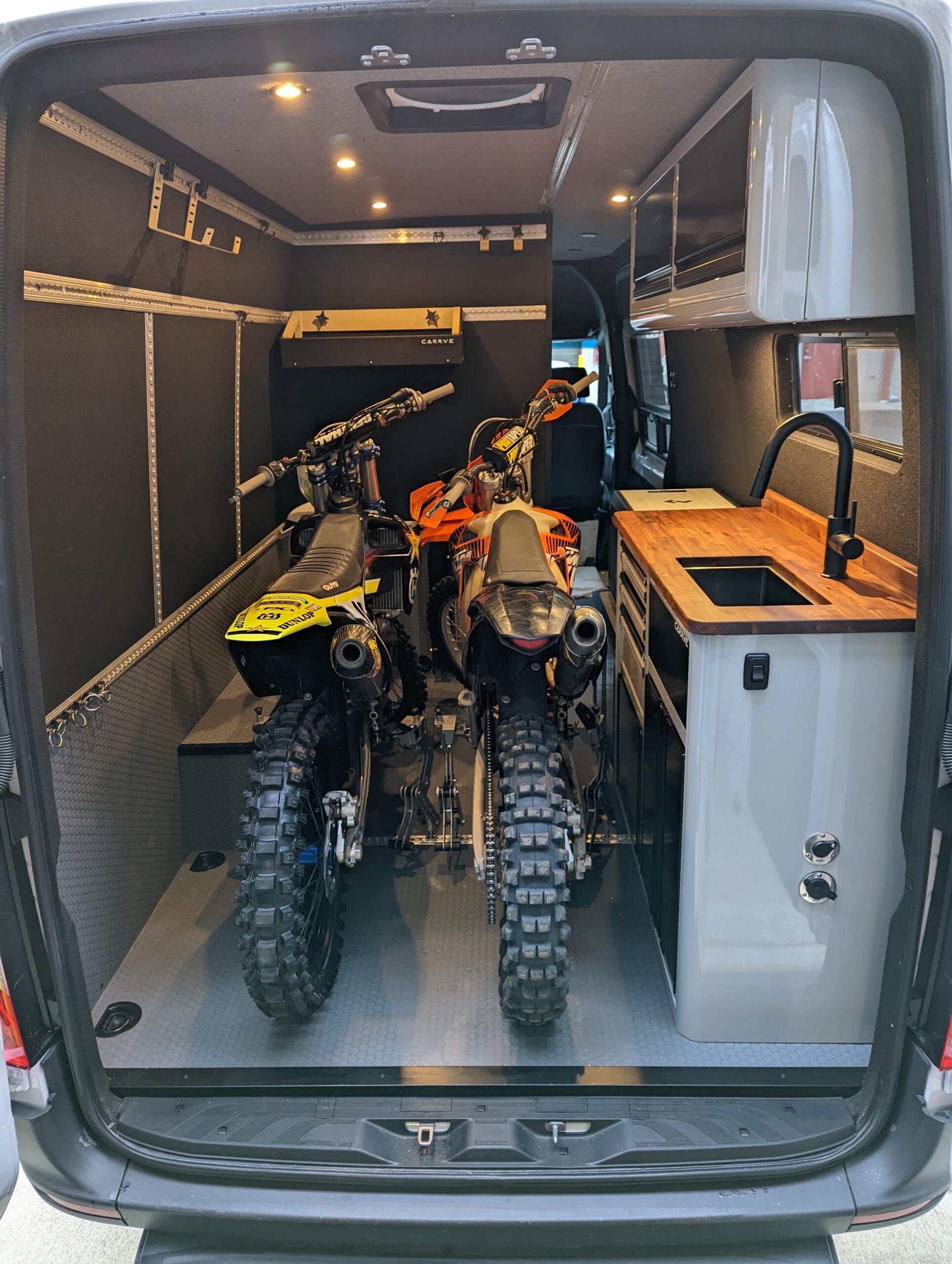 CARRVE Custom sprinter and Moto Cinch strapless tie downs