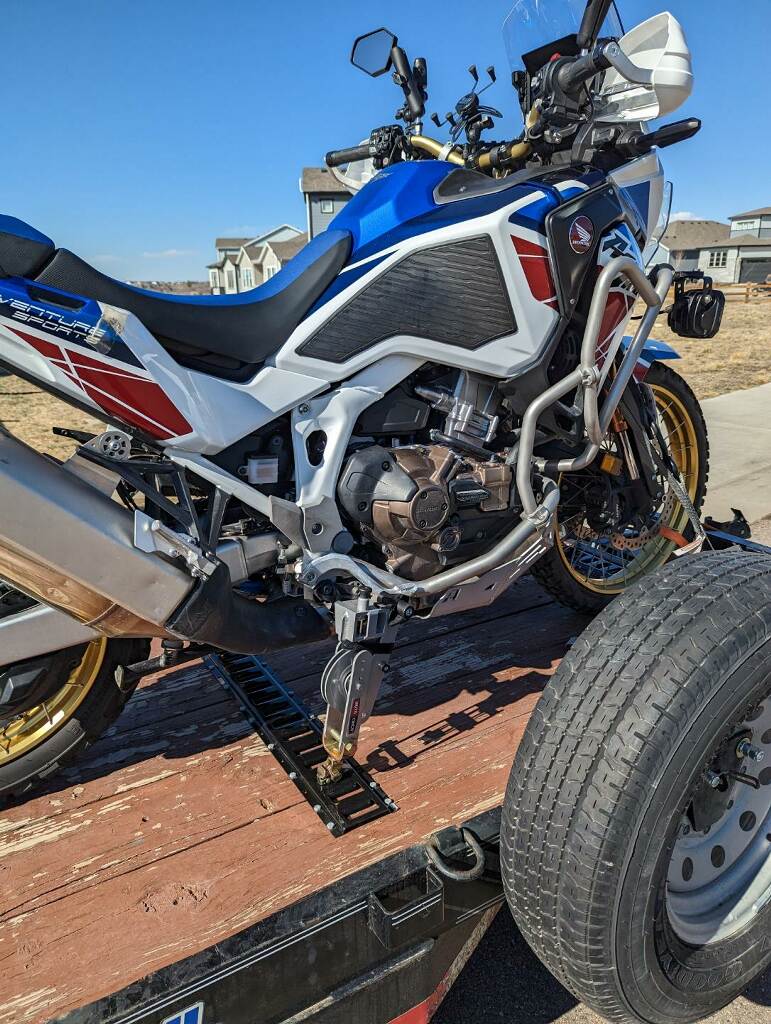 Honda Africa Twin and Moto Cinch foot peg tie down system