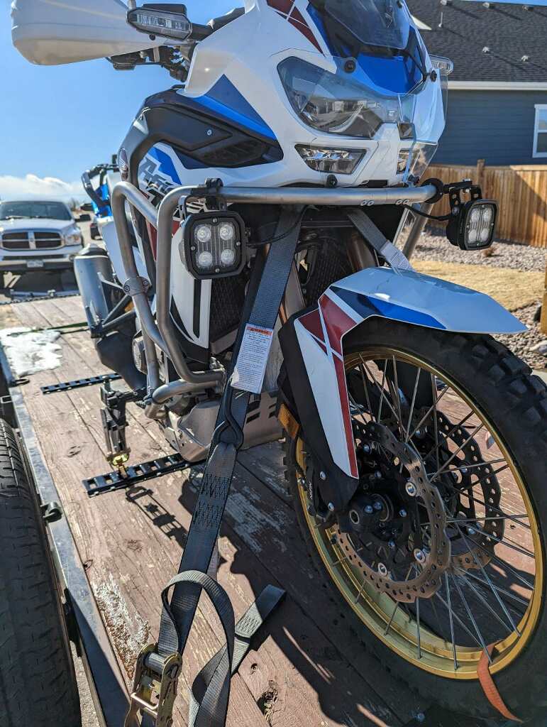 Honda Africa Twin and Moto Cinch foot peg tie down system